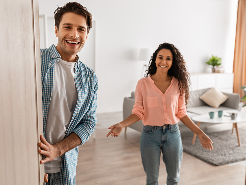 Happy People Opening Door to Their Home